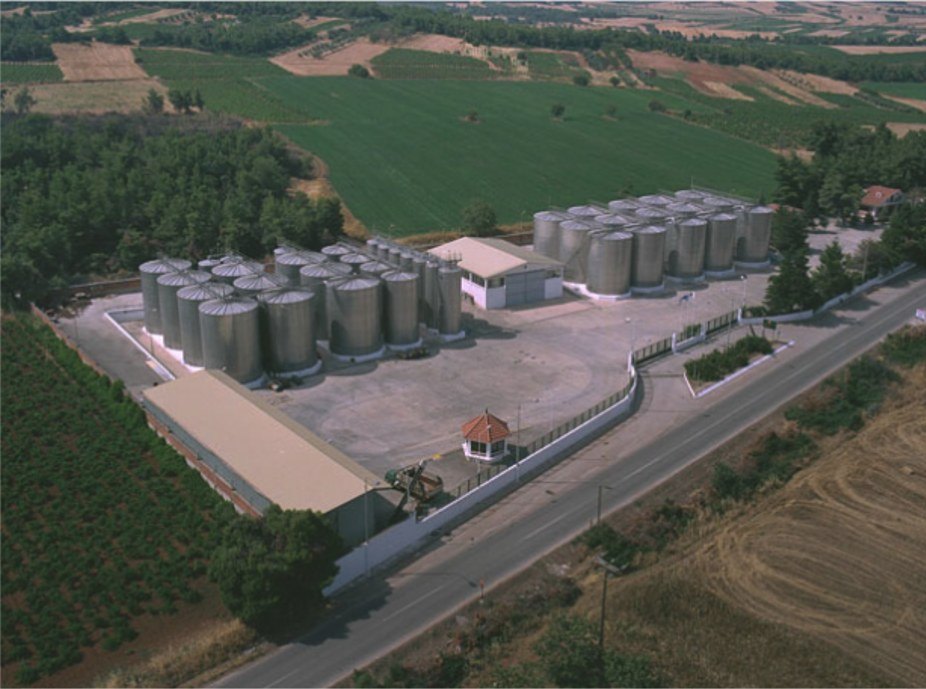 Aerial view of the Phoenix facility with stainless steel storage tanks beside vineyards